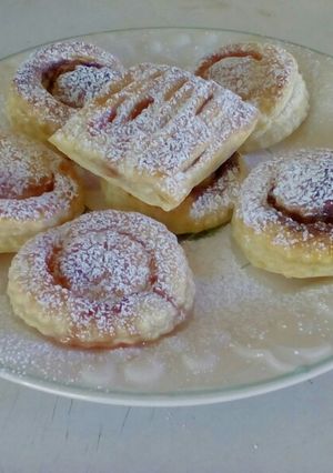A picture of Strawberry jam and chocolate pastry parcels.