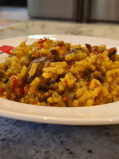 Una foto de Arroz cremoso de rabo de toro y boletus