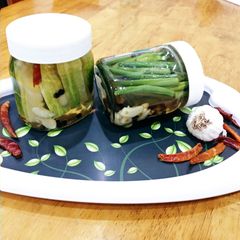 A picture of Pickled Green beans and Cucumbers.