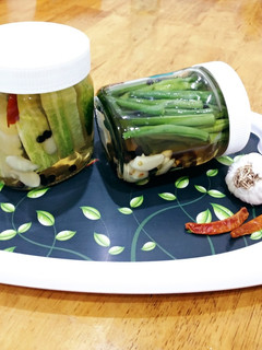 A picture of Pickled Green beans and Cucumbers.