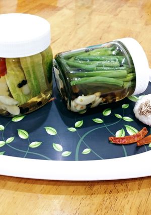 A picture of Pickled Green beans and Cucumbers.