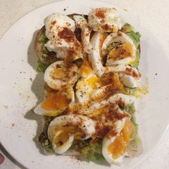 A picture of Sourdough bread with avocado.