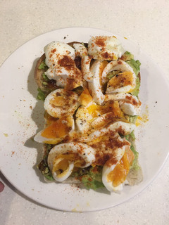 A picture of Sourdough bread with avocado.