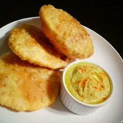 A picture of Dalpuri with hummus.