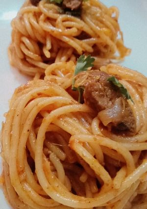 A picture of Spaghetti with meat ball in tandoori masala.