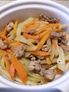 A picture of Slices of Pork Sauteed with Carrot and Sayote.