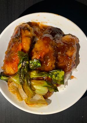 A picture of Asian Chicken over Jasmine Rice and  Baby Bok Choy.