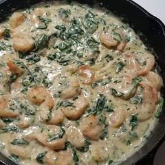 A picture of Spinach and prawns in cream sauce.