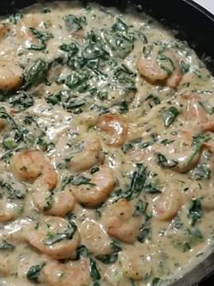 A picture of Spinach and prawns in cream sauce.