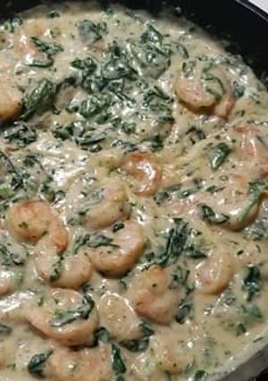 A picture of Spinach and prawns in cream sauce.
