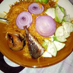 A picture of Abacha with fried fish.