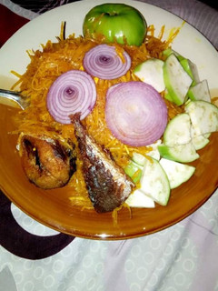 A picture of Abacha with fried fish.