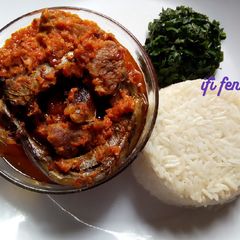 A picture of Palm oil stew paired with white rice.