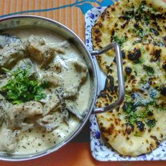 Malai Murg With Garlic Naan A picture of Malai Murg With Garlic Naan.