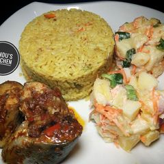 A picture of Jollof rice, potato salad and fish.
