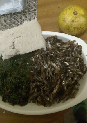 A picture of Dry fried Omena, and Kales with Ugali.