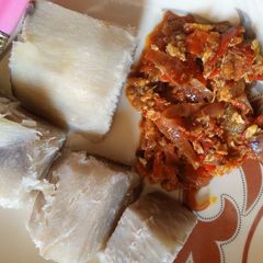 A picture of Boiled yam serve with egg sauce.