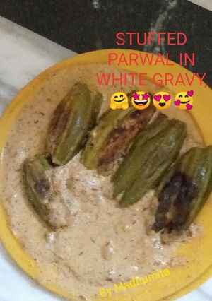 A picture of Stuffed parwal in white gravy.