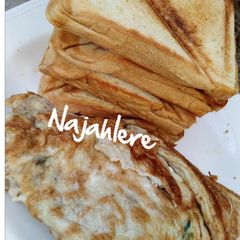 A picture of Toasted bread and fried eggs.