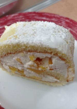 Una foto de Brazo de gitano de melocotón/chocolate
