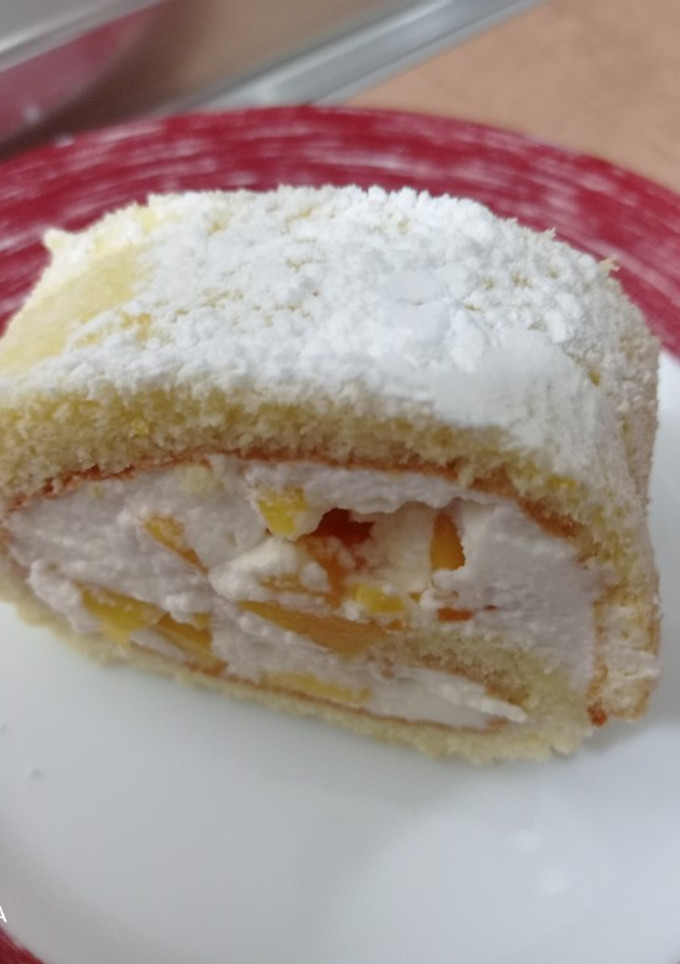 Una foto de Brazo de gitano de melocotón/chocolate