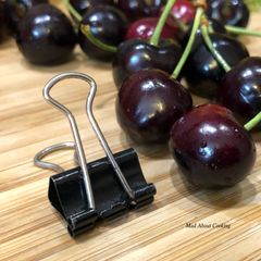 A picture of #HowTo “Pit Cherries” with a binder clip? - Tuesday Tip.