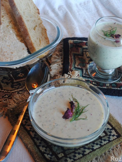 A picture of Cucumber soup with yogurt, raisins and walnut (Aab- dogh khiar).