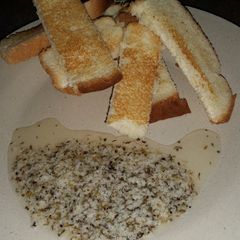 A picture of Sweet Parmesan Dipping Oil with Whole Wheat Bread.