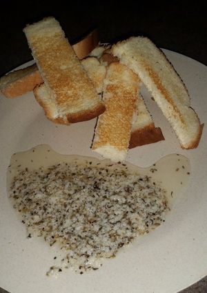 A picture of Sweet Parmesan Dipping Oil with Whole Wheat Bread.