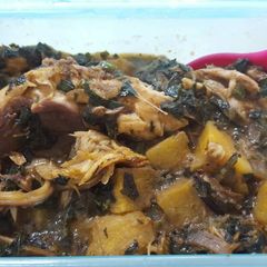 A picture of Plantain porriage with ugu and fish.