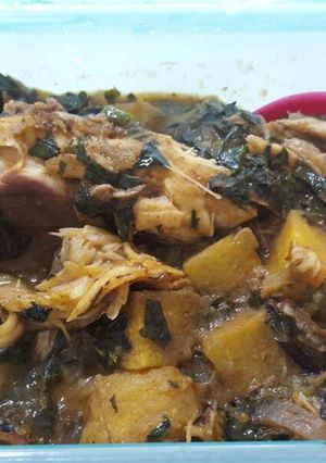 A picture of Plantain porriage with ugu and fish.