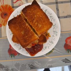 A picture of Pizza hidden in sandwich.