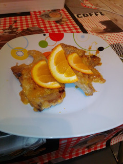 Una foto de Chuletas de lomo en salsa de naranja