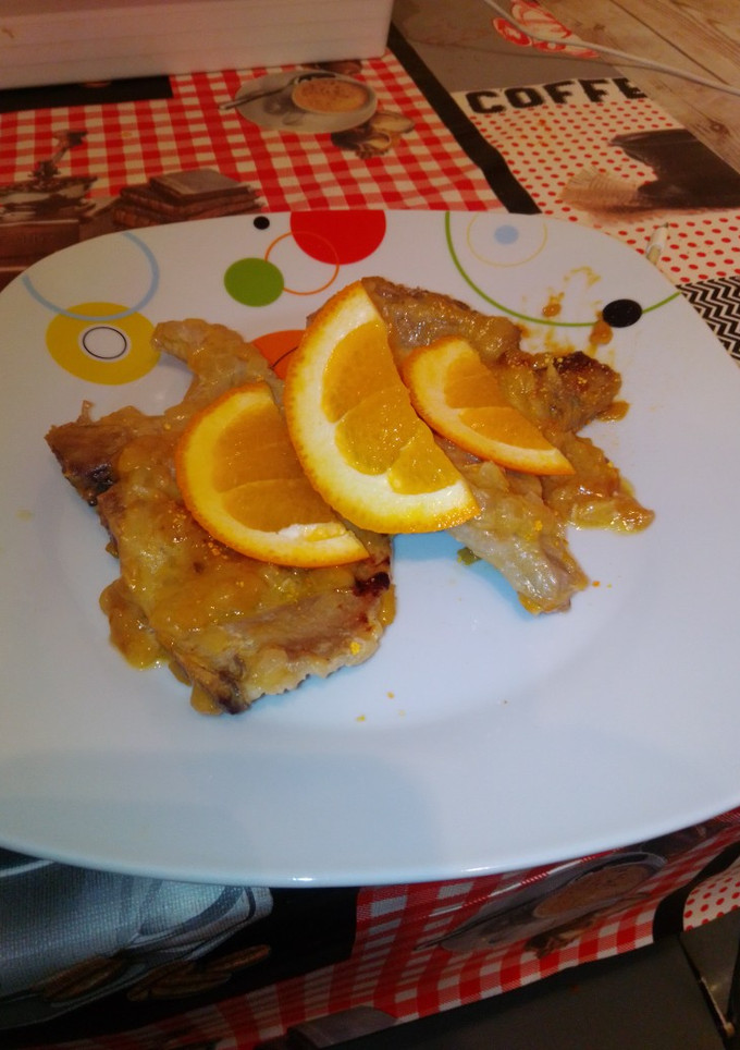 Una foto de Chuletas de lomo en salsa de naranja