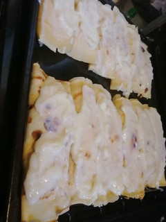 Una foto de Canelones de pollo, jamón y queso