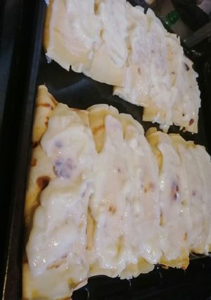 Una foto de Canelones de pollo, jamón y queso