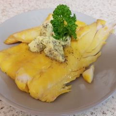 A picture of My lovely piece of Poached Smoked Haddock with herb Butter.