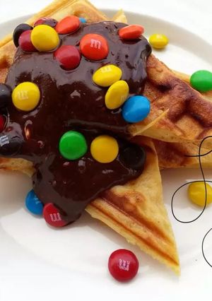 A picture of Cinnamon Waffle With Chocolate and M&M.