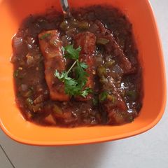 A picture of Crispy Panner with hot sauce.