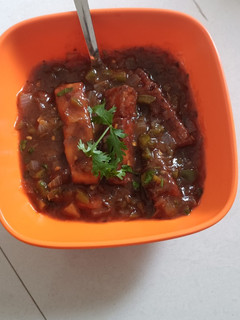 A picture of Crispy Panner with hot sauce.