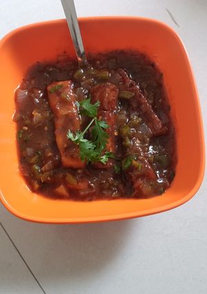 A picture of Crispy Panner with hot sauce.