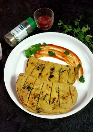 A picture of Home made cheese garlic bread.