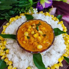 A picture of Corn curry with rice.