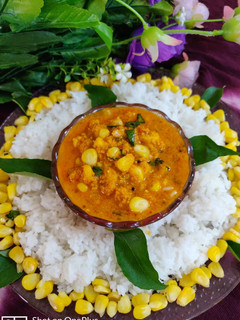 A picture of Corn curry with rice.