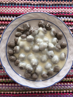 Una foto de Ñoquis de batata con salsa blanca