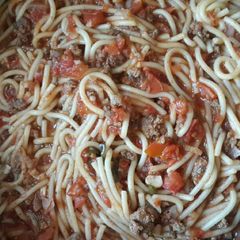 A picture of Fettuccini with meat & basil.