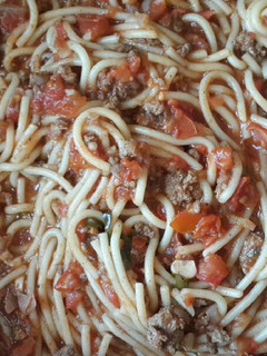 A picture of Fettuccini with meat & basil.