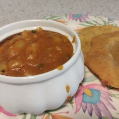 Aloo tarkari with aloo wali puri A picture of Aloo tarkari with aloo wali puri.