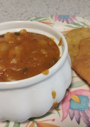 A picture of Aloo tarkari with aloo wali puri.