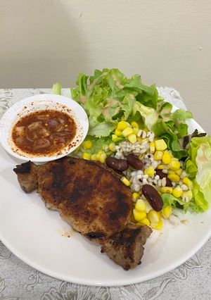 A picture of Grilled pork with Northeastern Thai spicy sauce.